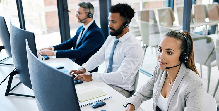 Team using headsets and computers
