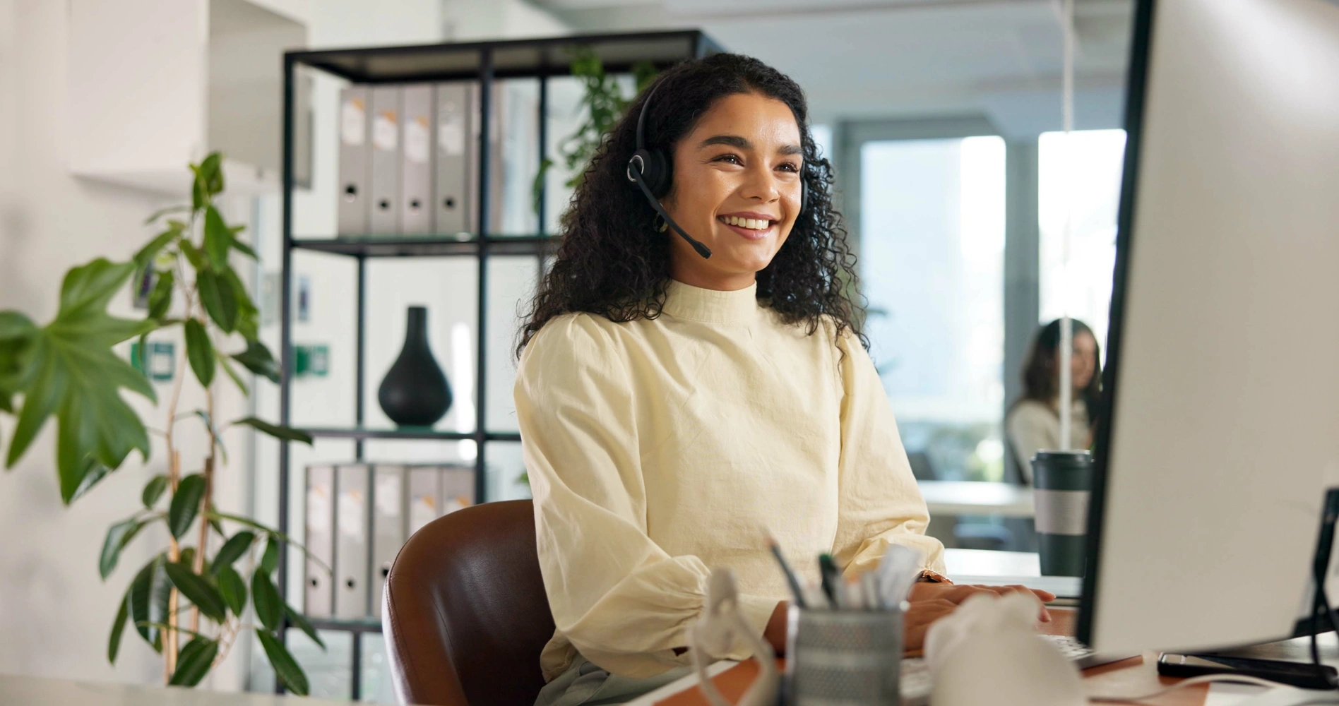 Happy woman and customer service in office with computer, communication and online consulting. Reading, virtual chat or smile for contact support, help desk or sales agent for business.