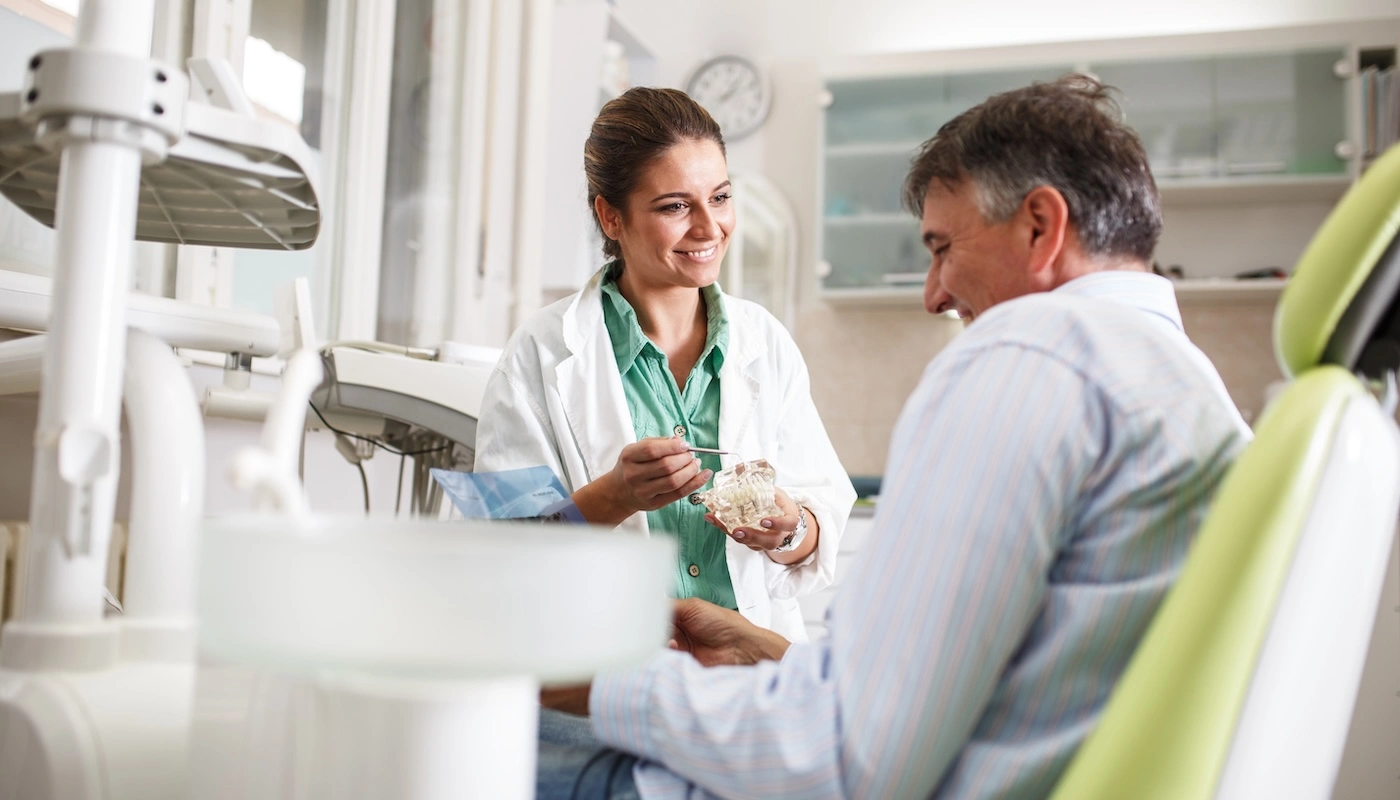 Dentist talking with patient